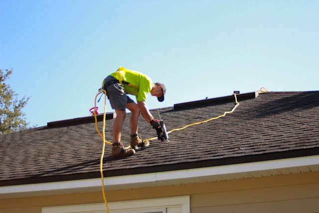 man repairing a roof